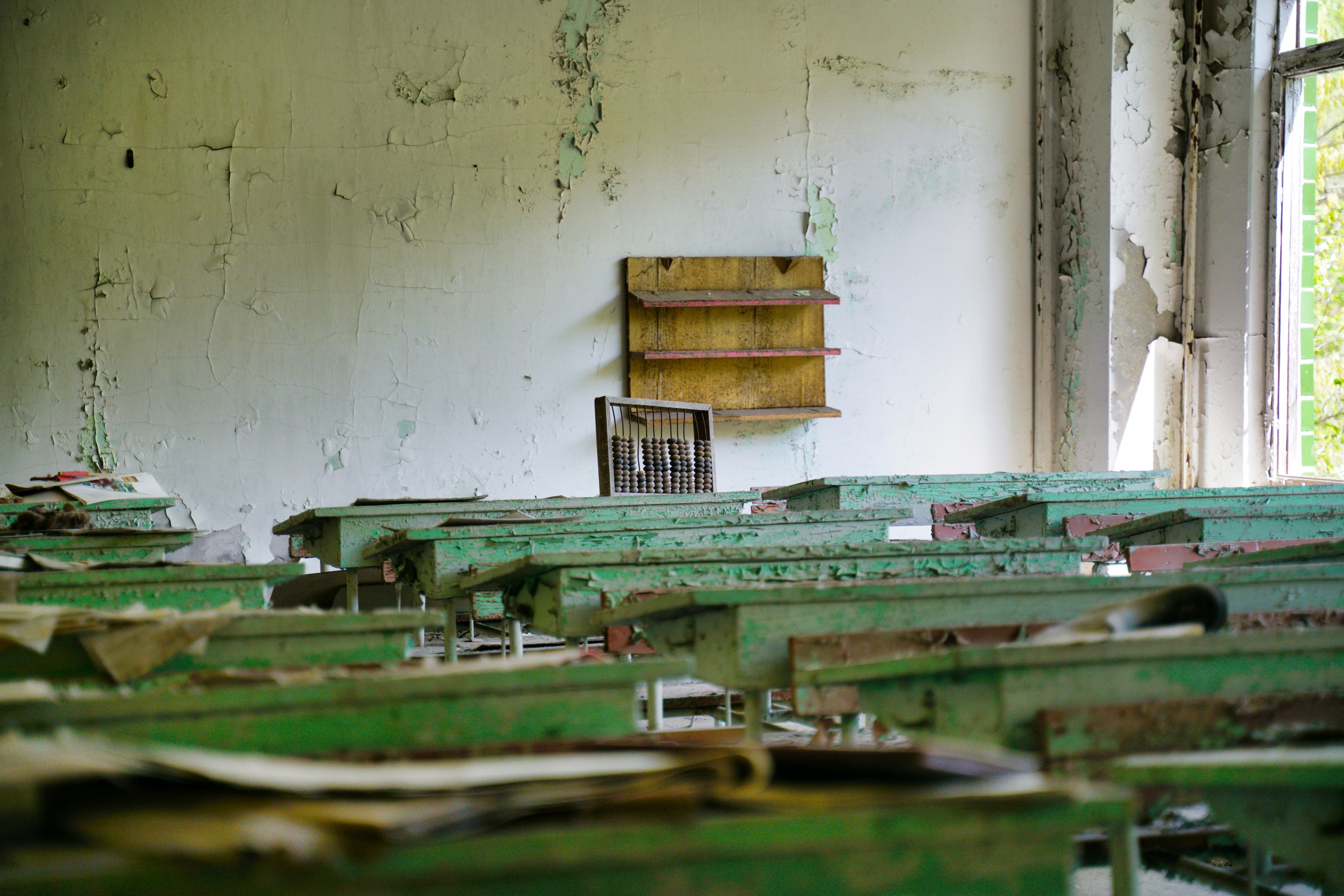 stack of books on white wall