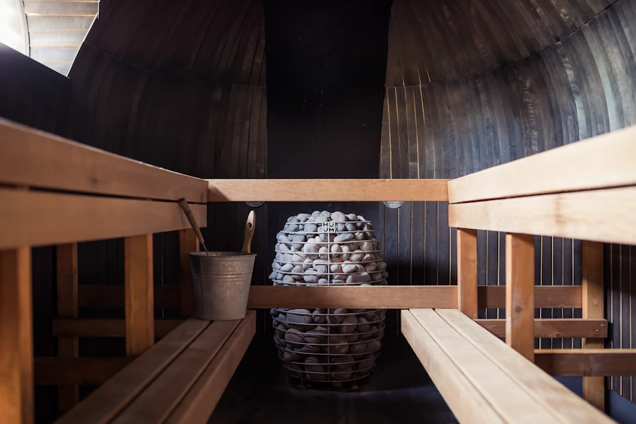 The benches and stove of a barrel sauna