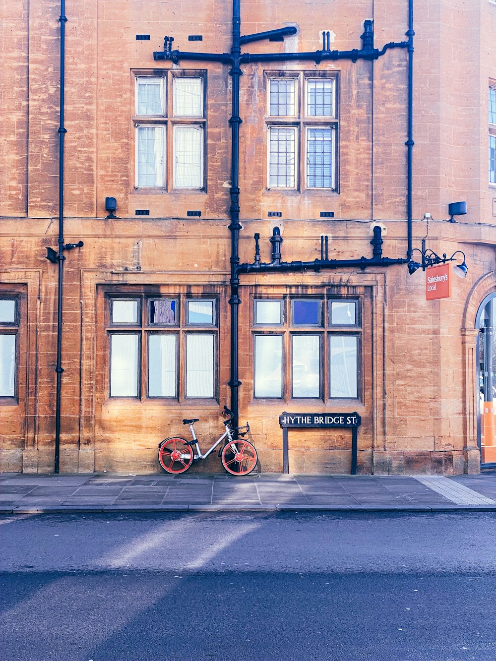 a bike is parked in front of a building