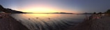 A panoramic view of a serene beach at sunset.