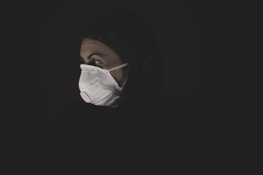 woman in white face mask