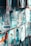 Numerous paintings, each depicting vibrant street scenes with colorful buildings and arched doorways, are displayed side by side. The images are rich in blue and turquoise tones, reflecting a Mediterranean or North African aesthetic.