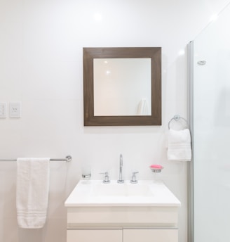 white ceramic sink with faucet