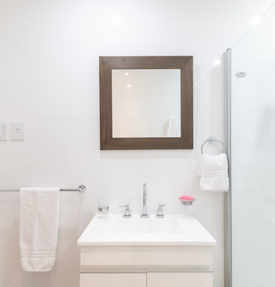 white ceramic sink with faucet