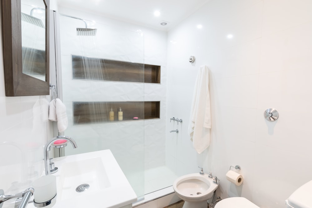 white ceramic sink near white ceramic sink