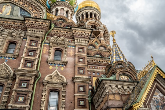 brown and blue concrete building under blue sky during daytime in Church of the Savior on Blood Russia