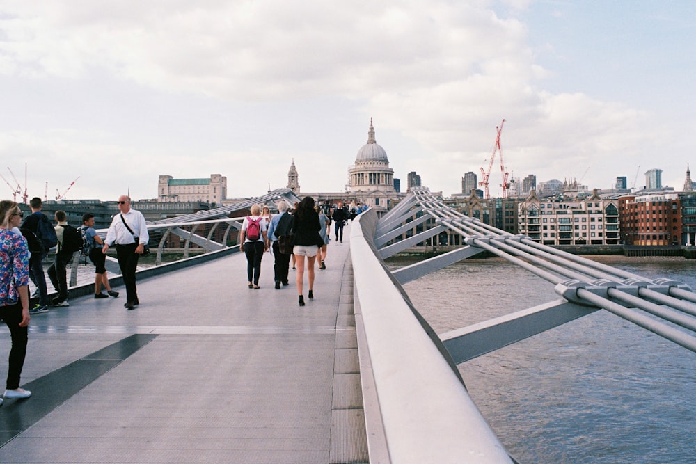 people walking on bridge during daytime