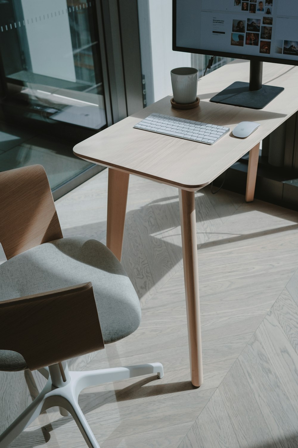 white ceramic mug on brown wooden table