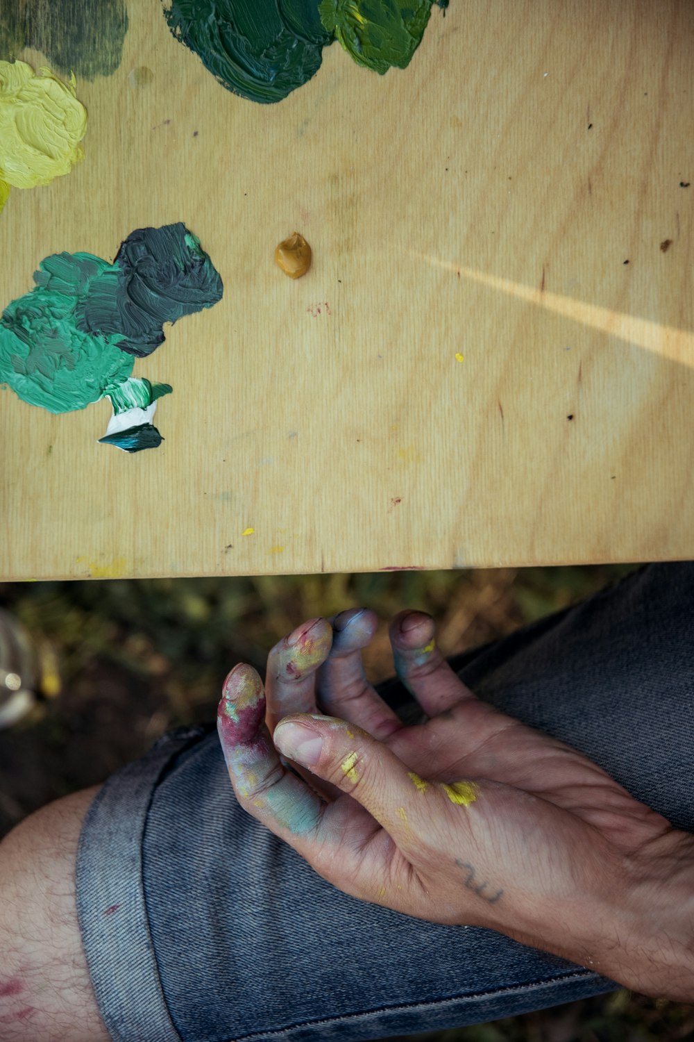 green leaf on brown wooden table