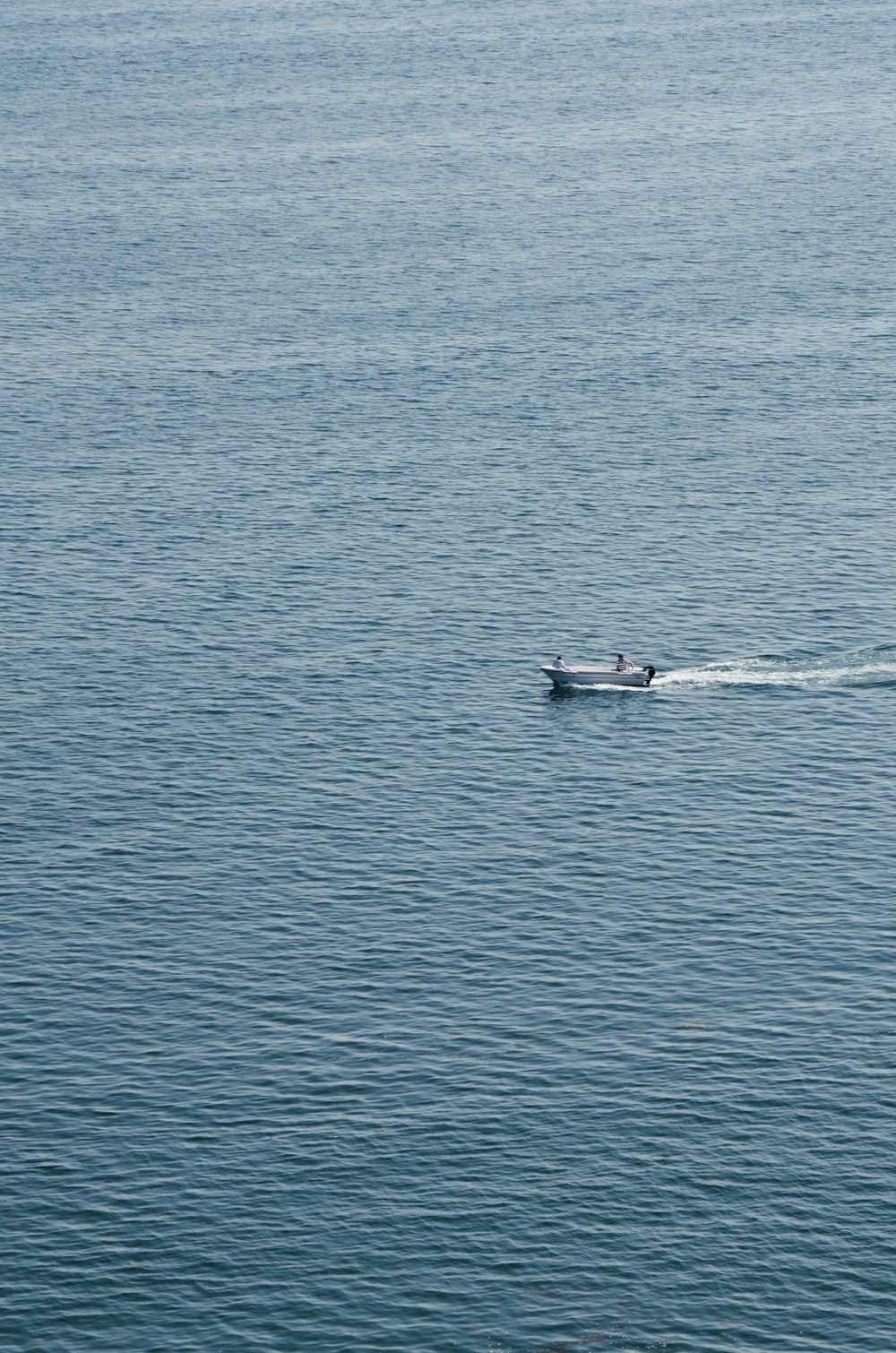 person surfing on blue sea during daytime