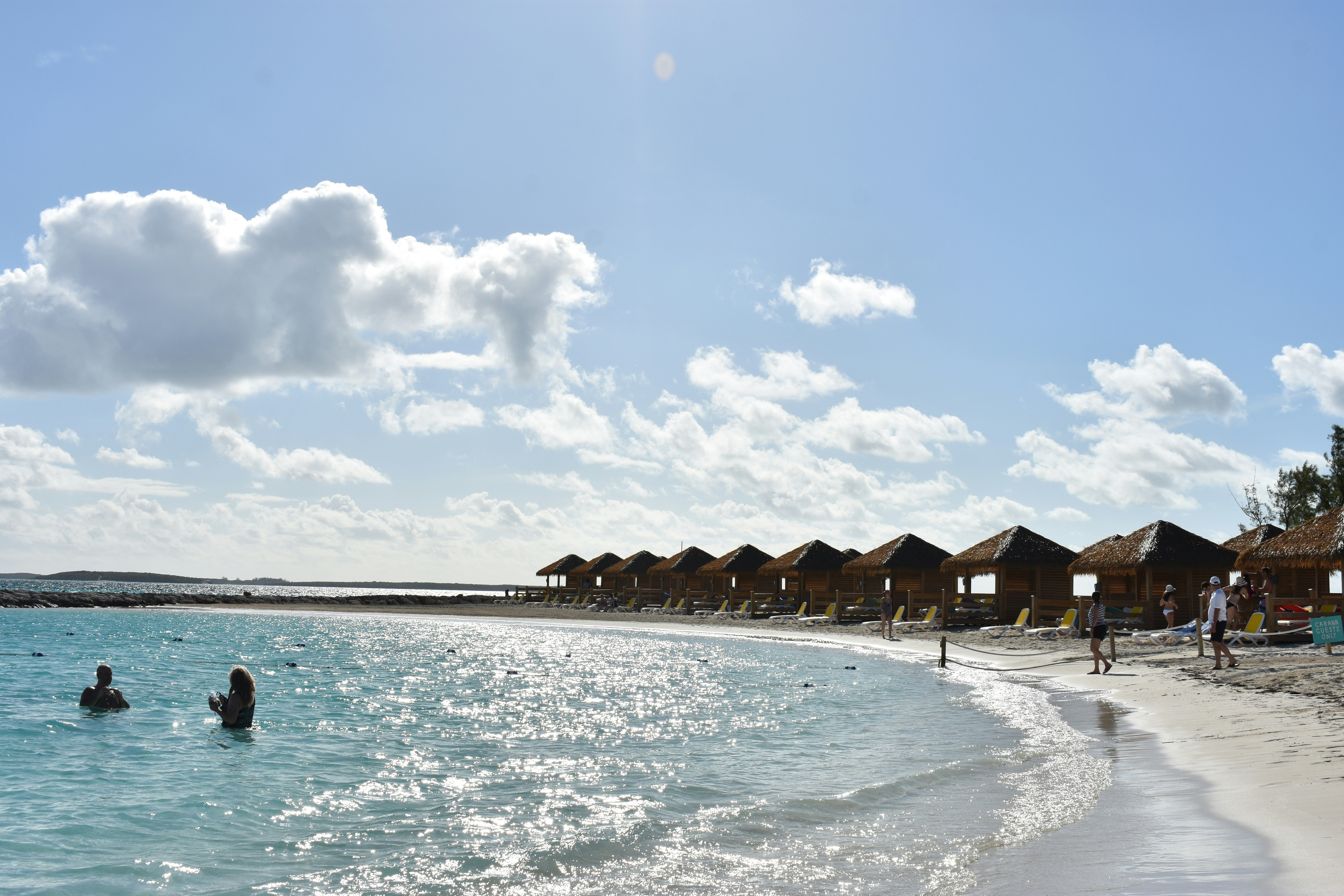 brown wooden house on beach during daytime