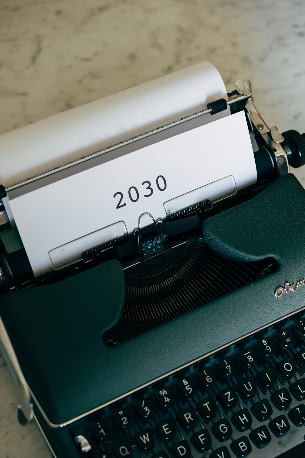 a close up of a typewriter on a table