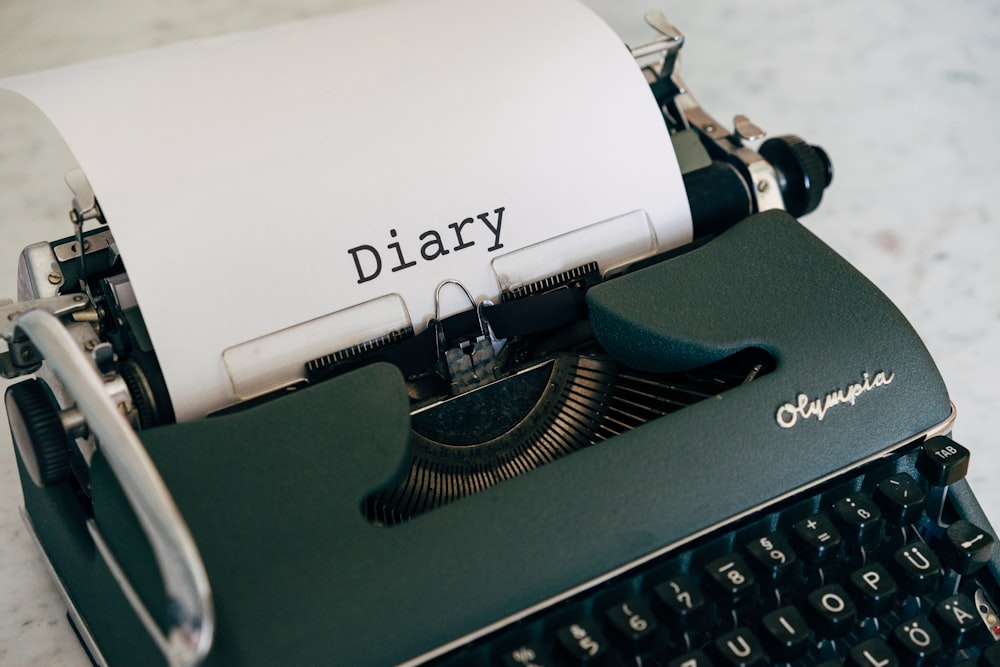 a close up of a typewriter with a paper on it