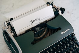 a close up of an old fashioned typewriter