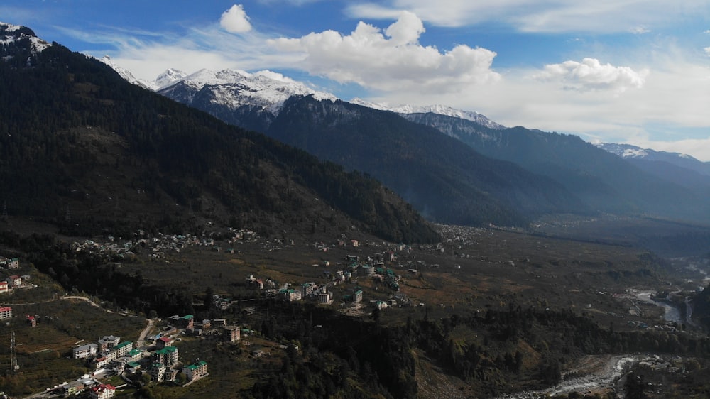 green and brown mountains under white clouds during daytime