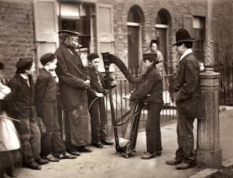 Young learners gathered around a street musician, listening and absorbing the sounds of the city.