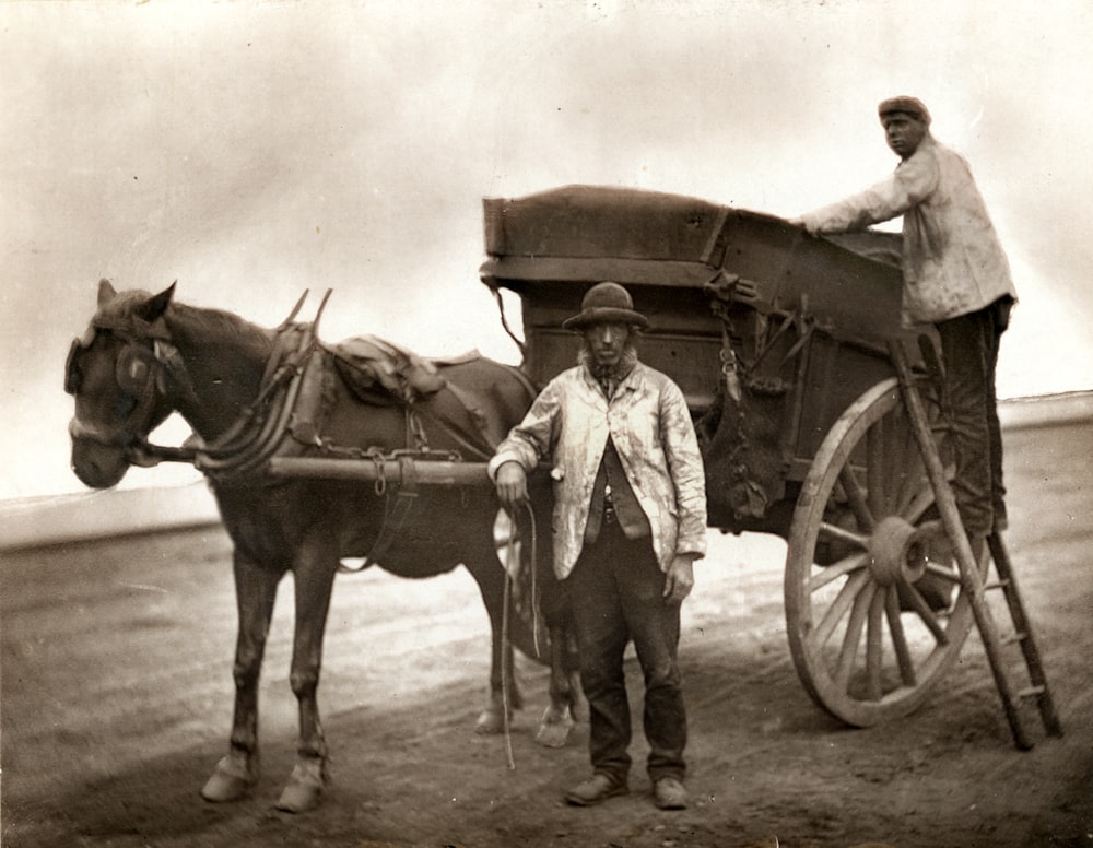 man in cowboy hat riding horse