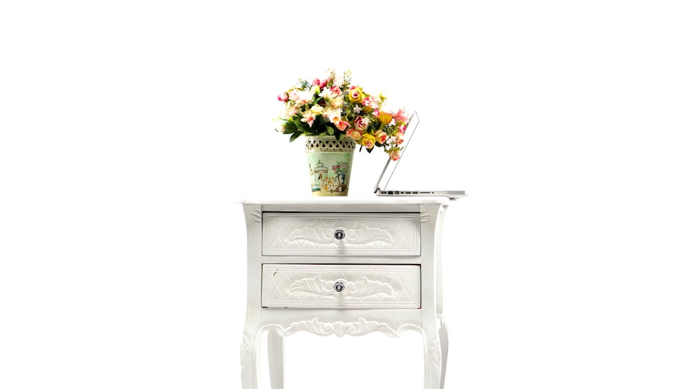 white and pink flowers on white wooden 2 drawer chest