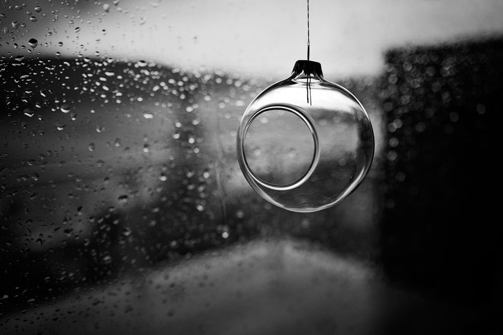 water drop in grayscale photography