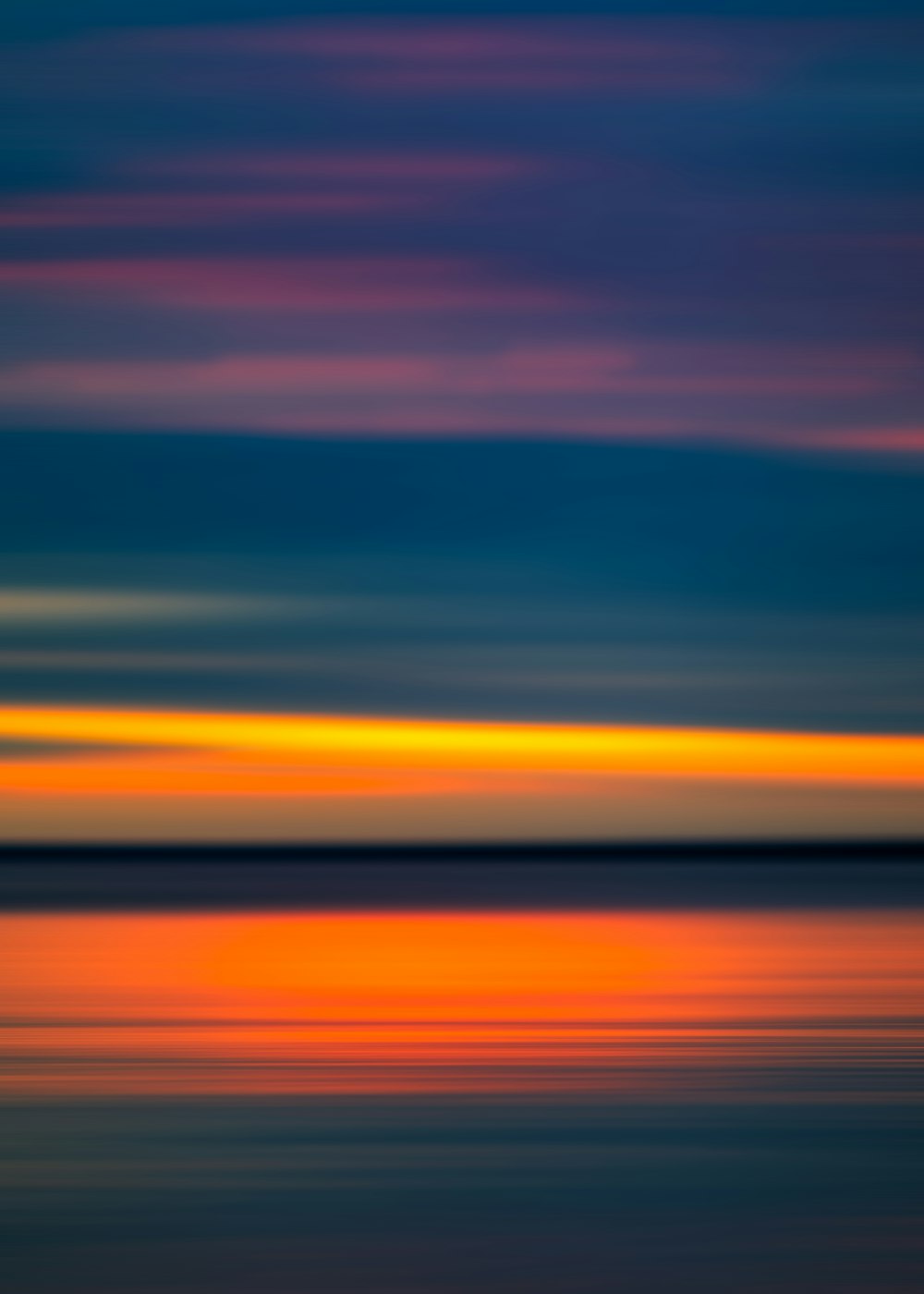 blue and orange sky over the sea