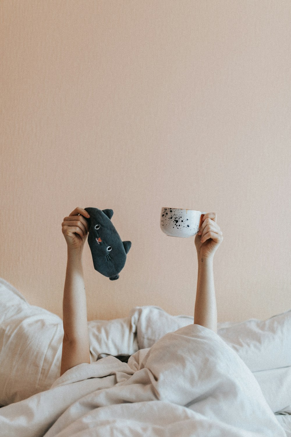 person holding white ceramic mug