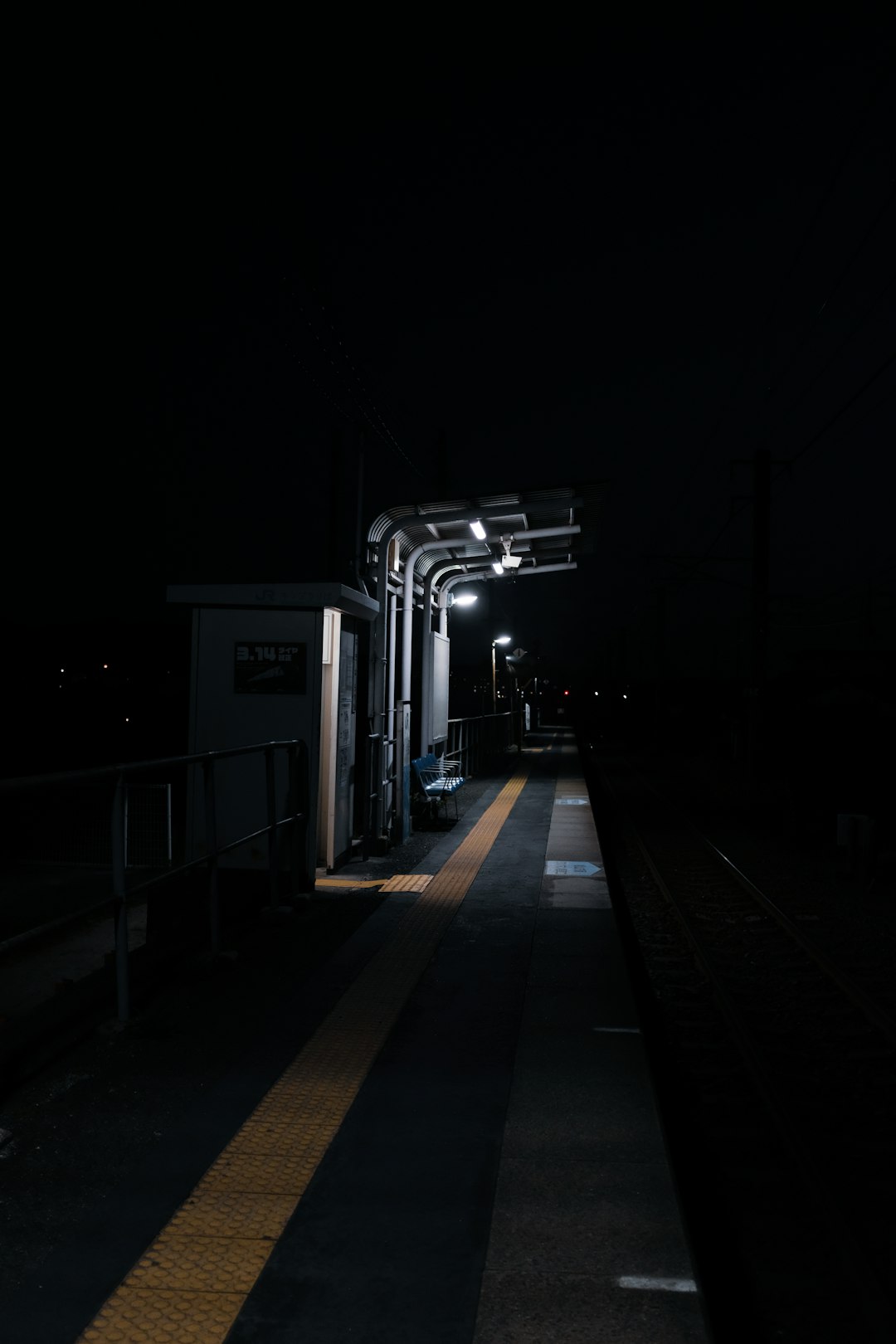 black and white train station during night time