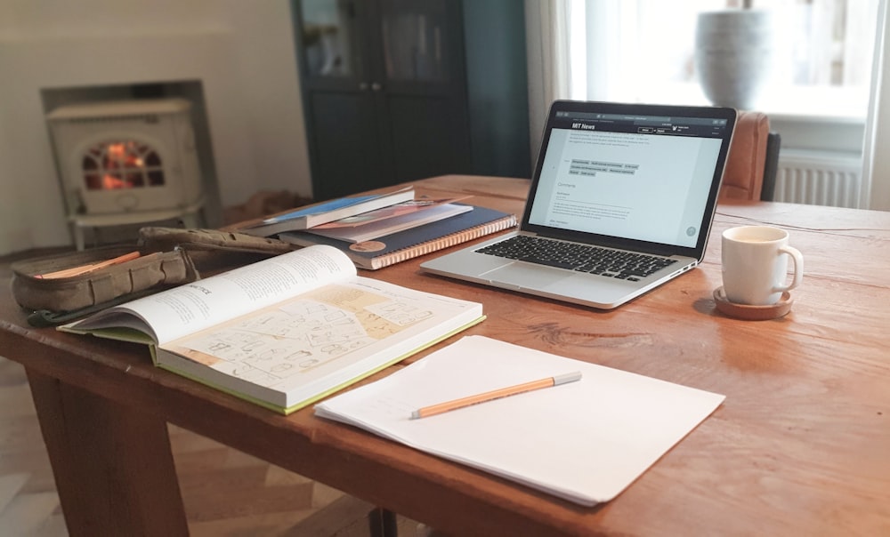 macbook air on brown wooden table