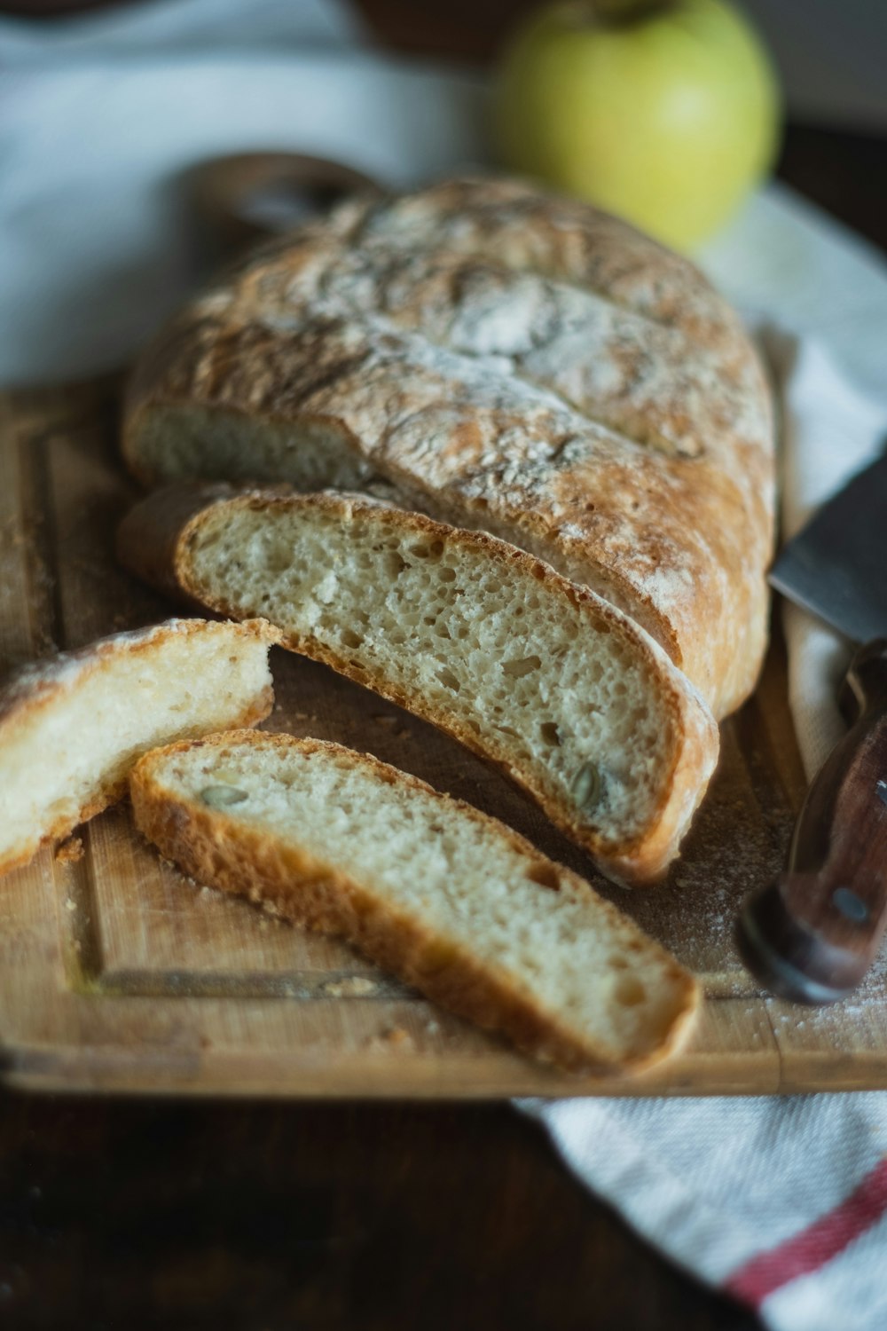 sliced bread on brown wooden chopping board