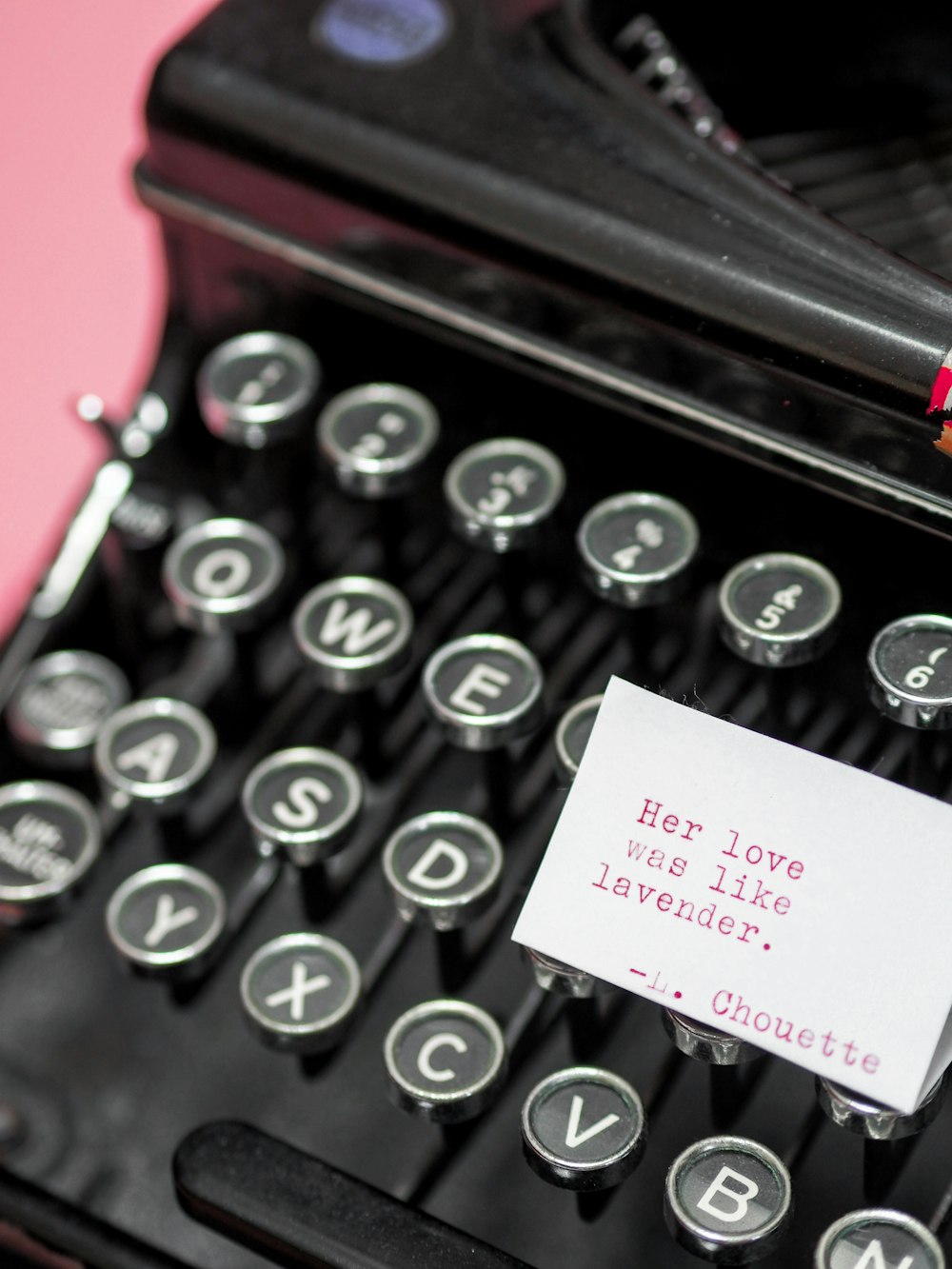 black and white typewriter with white printer paper