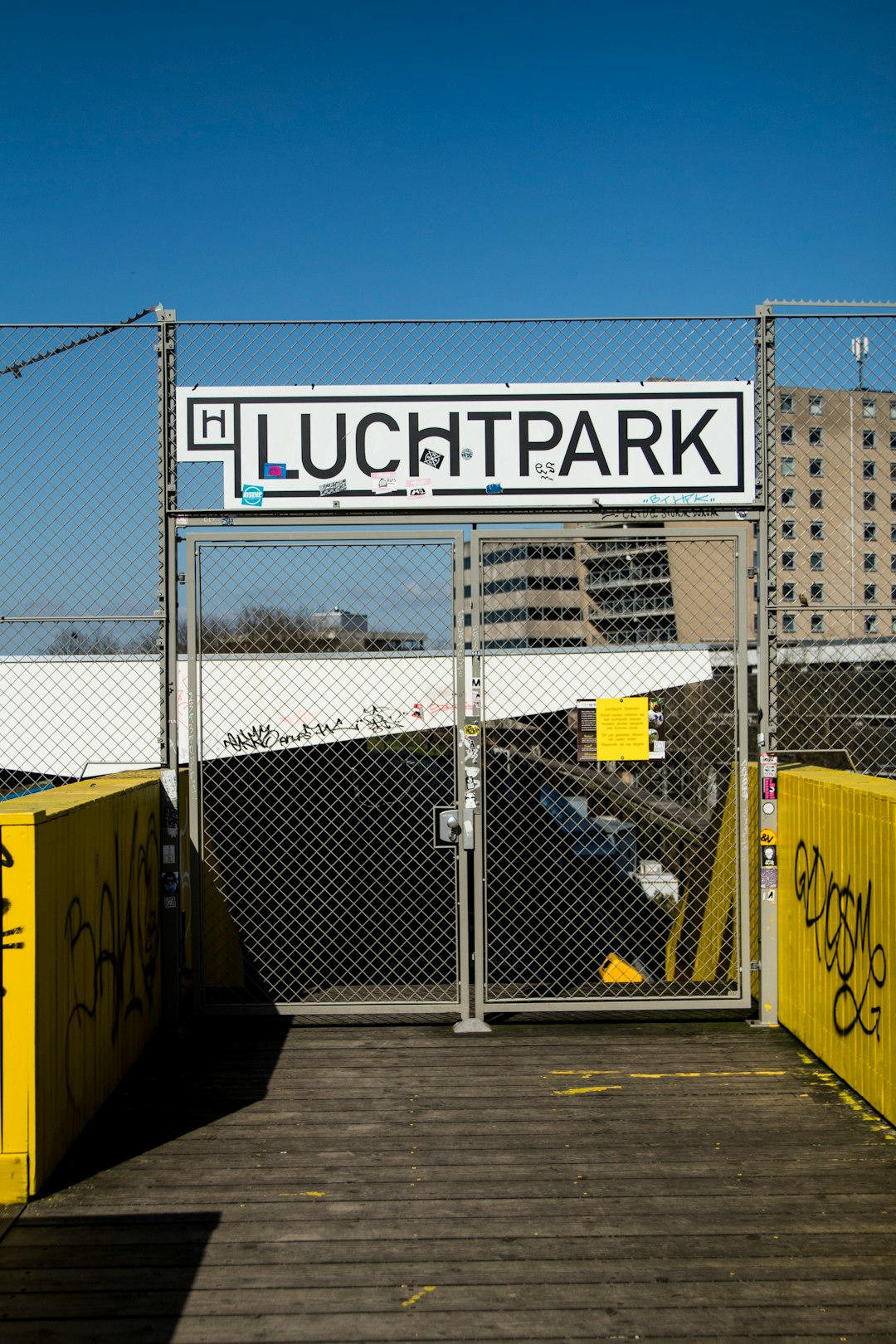 yellow and black steel fence