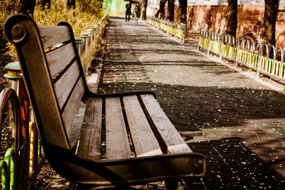 brown wooden bench on brown brick floor