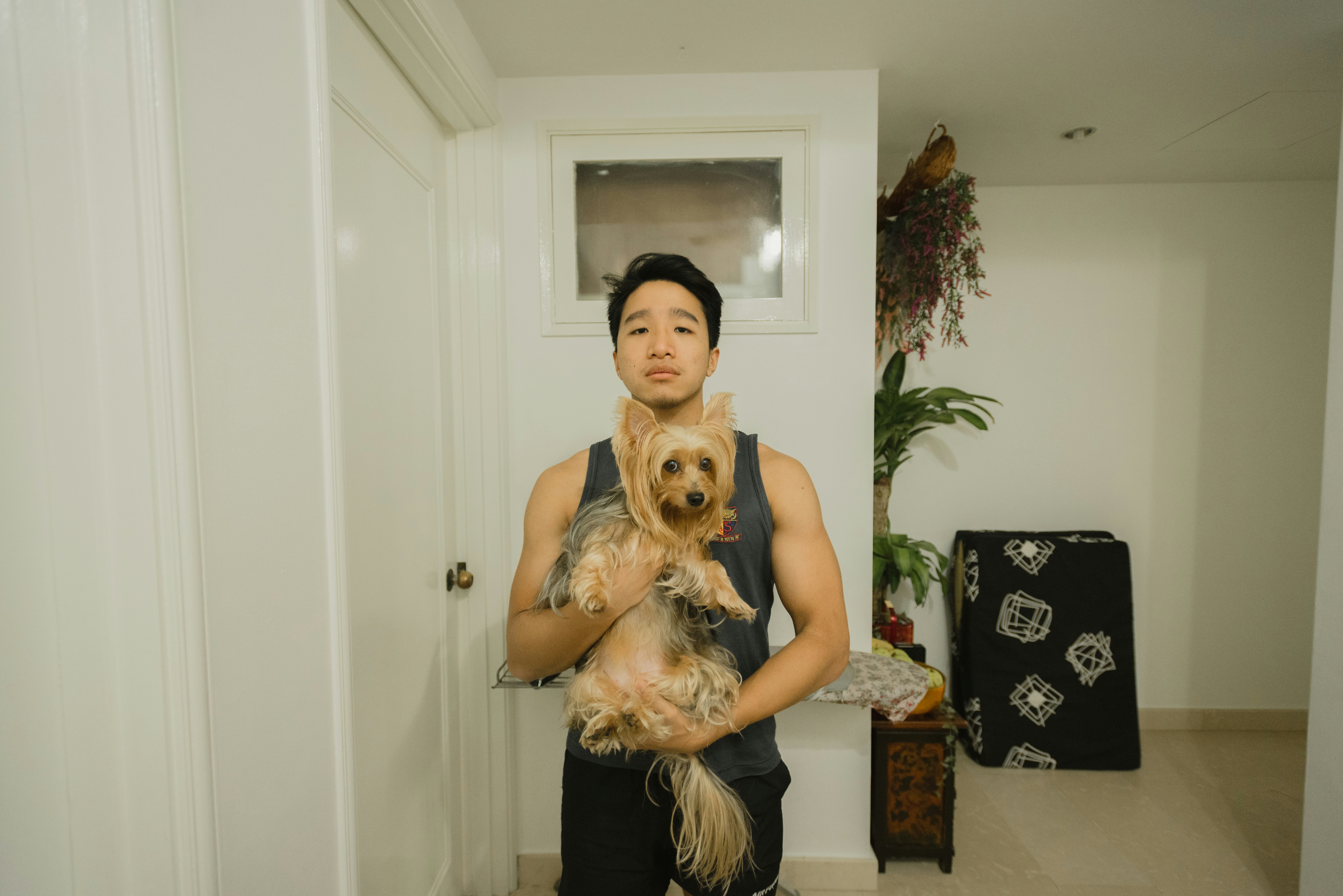 resident with a dog in a modern living room - 1 bed 1 bath pet friendly