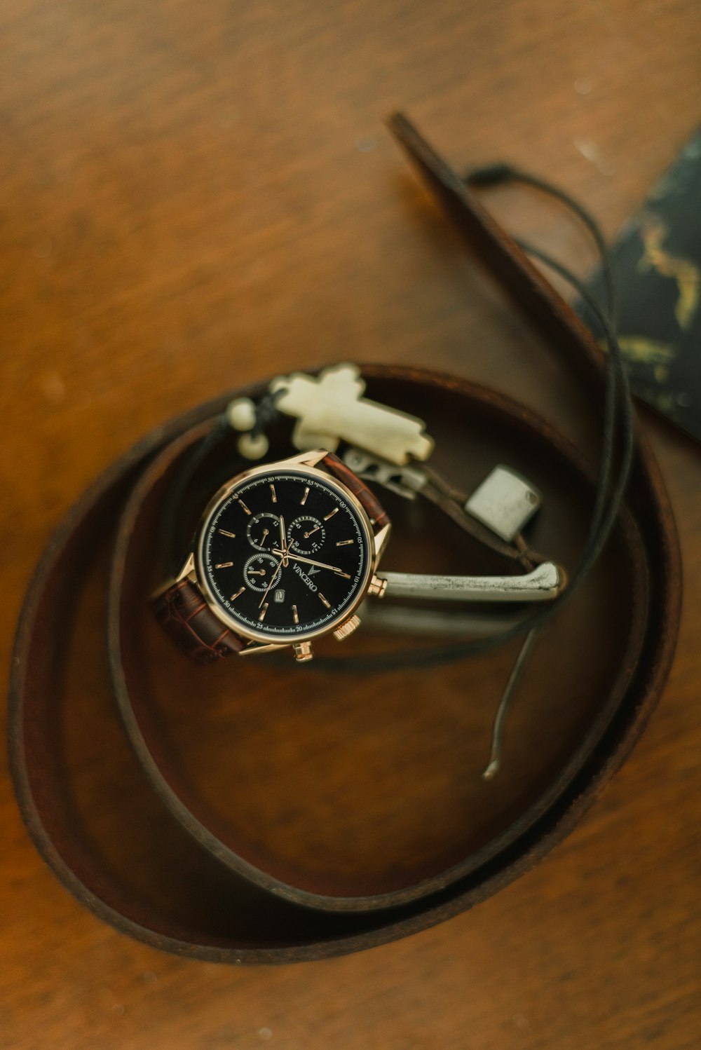 silver and black round analog watch