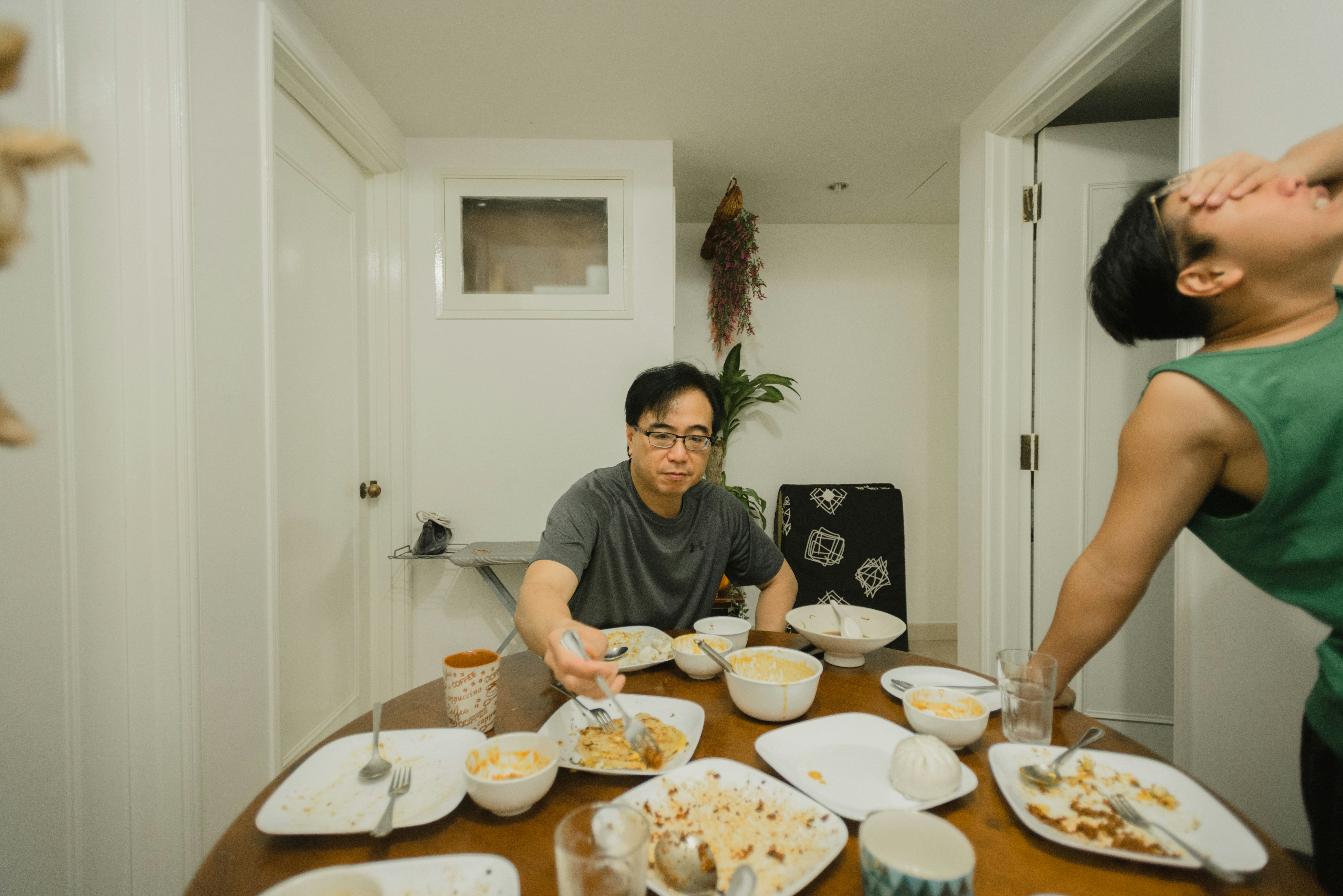 woman in gray crew neck t-shirt sitting on chair