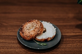 bread with white cream on black round plate