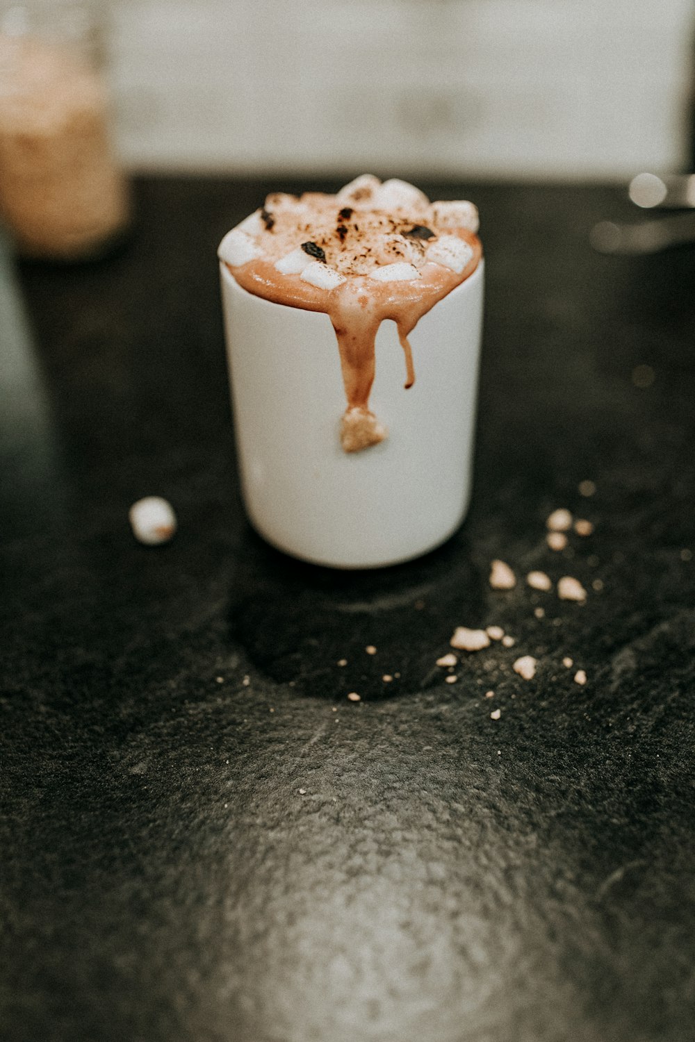 white ceramic mug with brown and white liquid