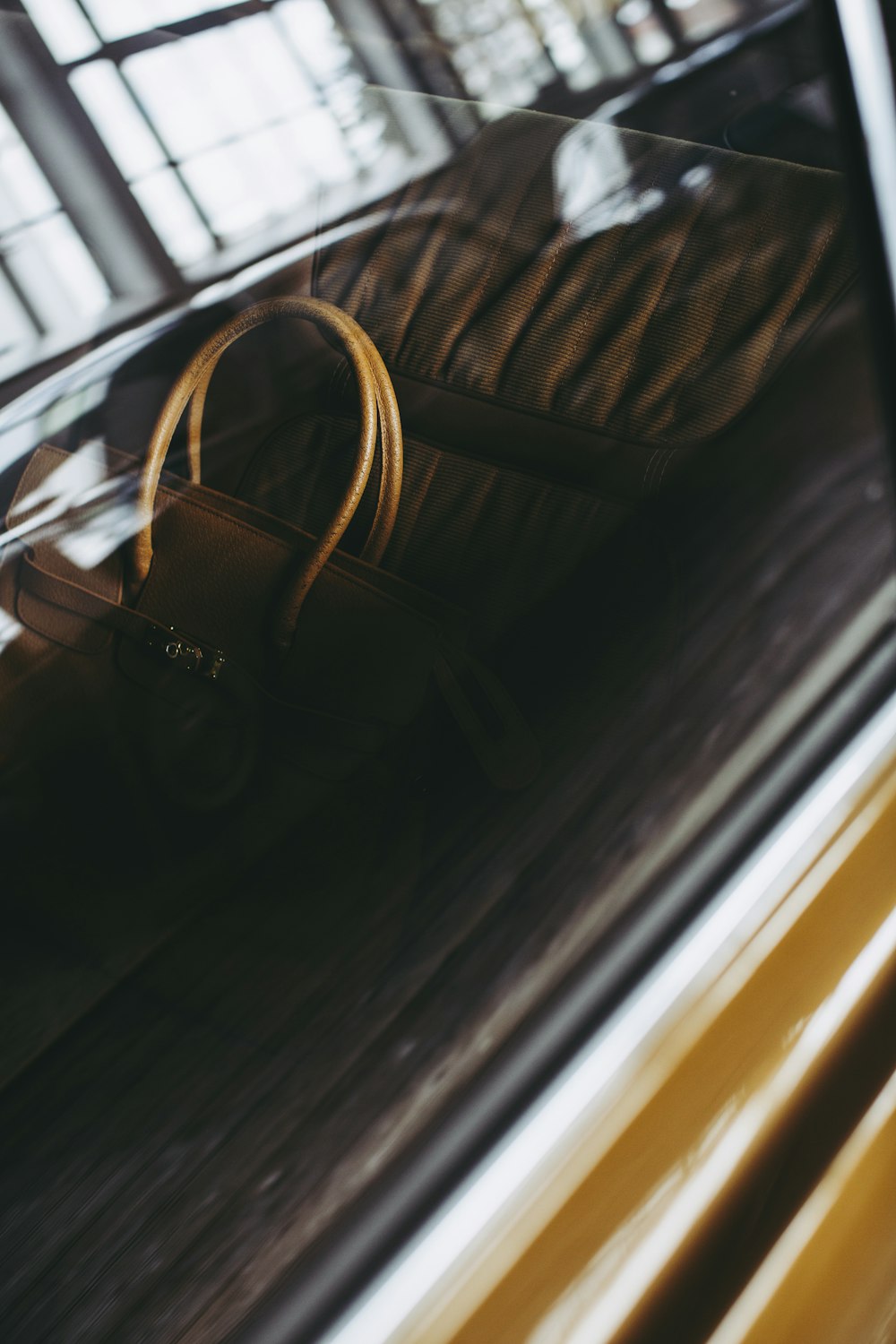 black framed eyeglasses on brown wooden table