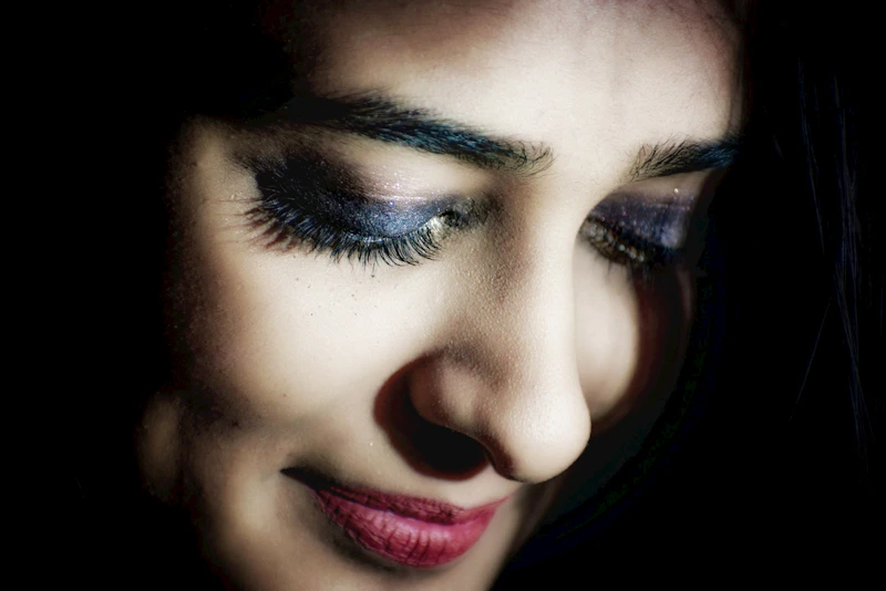 glamorous woman with red lipstick and bold mascara