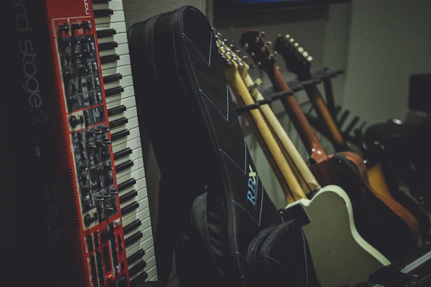 A vibrant display of various musical instruments including guitars, keyboards, and drums in a cozy studio setting