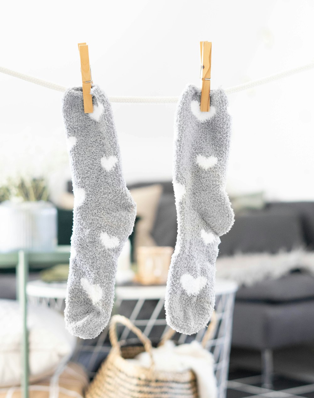 white and gray socks on brown wooden clothes hanger