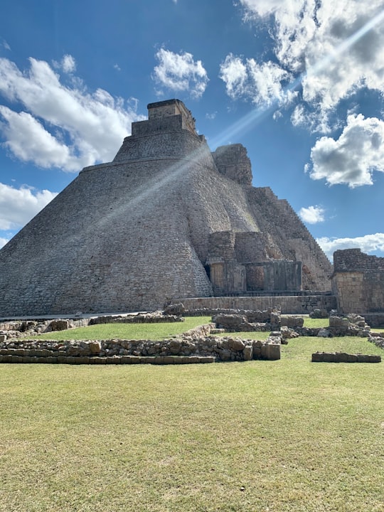 gray pyramid under blue sky during daytime in Pyramid of the Magician Mexico