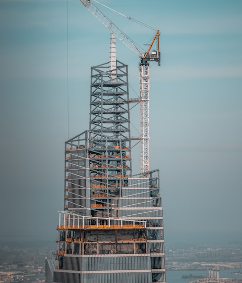 gray metal tower under gray sky