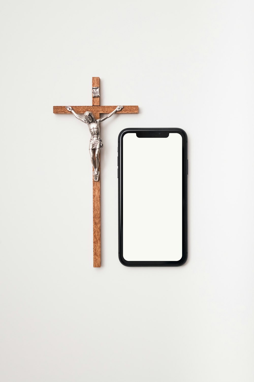 brown wooden cross with white background
