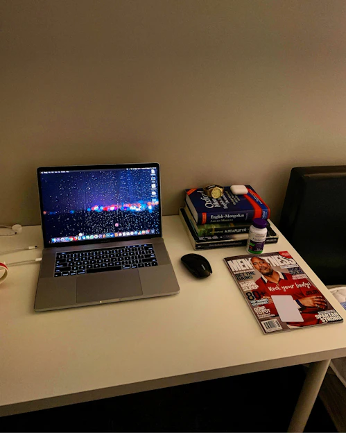 A cozy home setting with a laptop open to the Nexavita online store, surrounded by neatly packaged products ready for delivery.