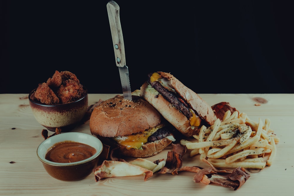 burger and fries on black plate