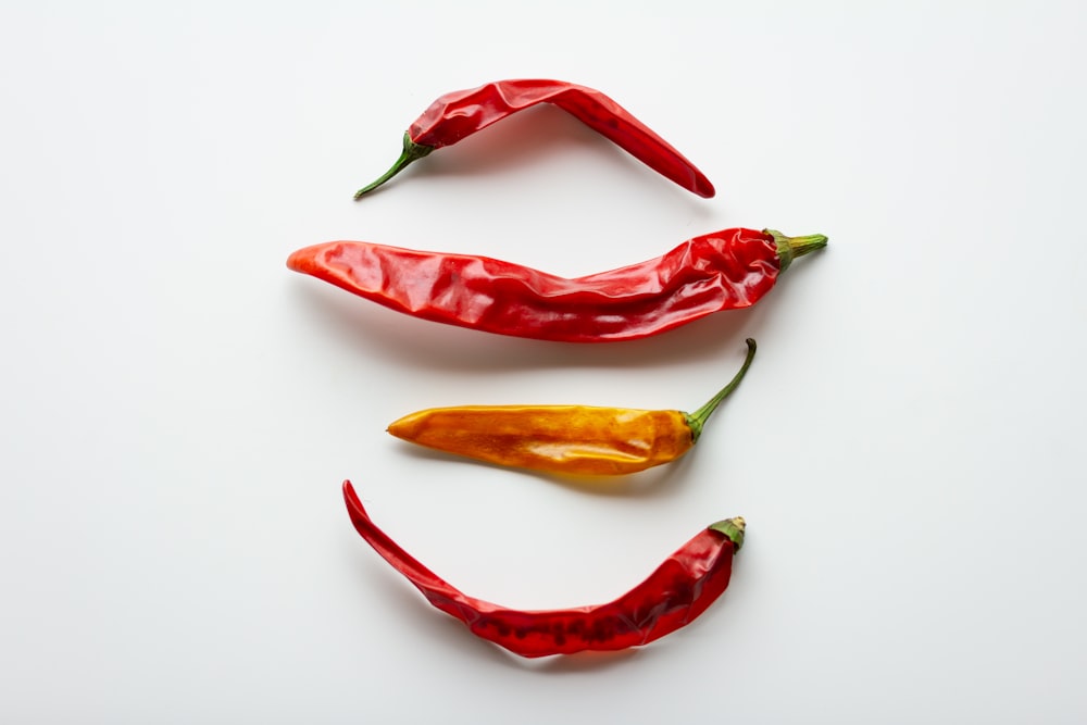 red chili pepper on white surface