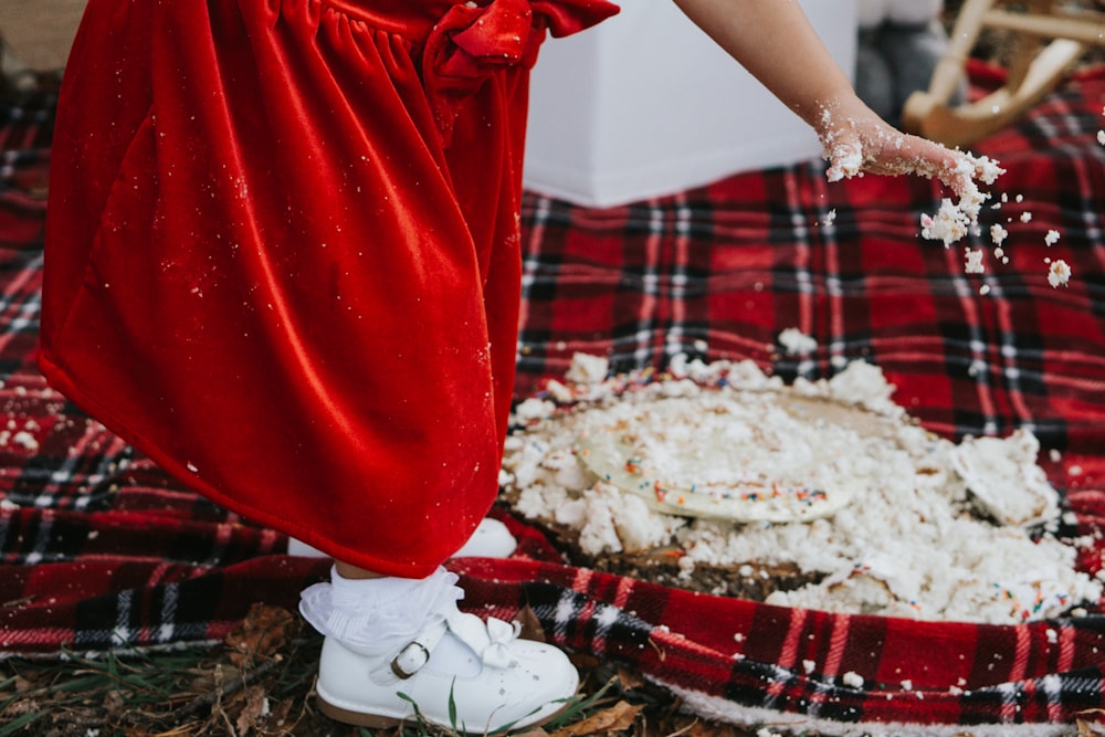 person in red pants and white shoes