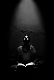 Jason in a warmly lit room, deeply focused during a live one-on-one reading session.