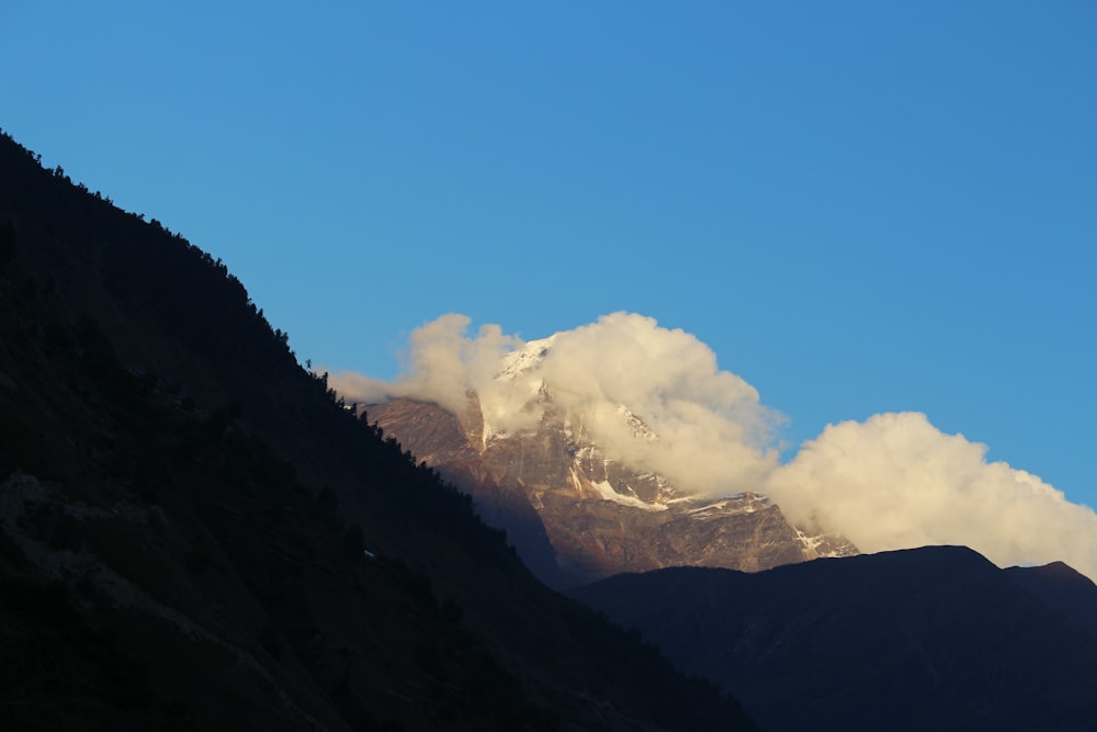 brown and green mountains under blue sky during daytime