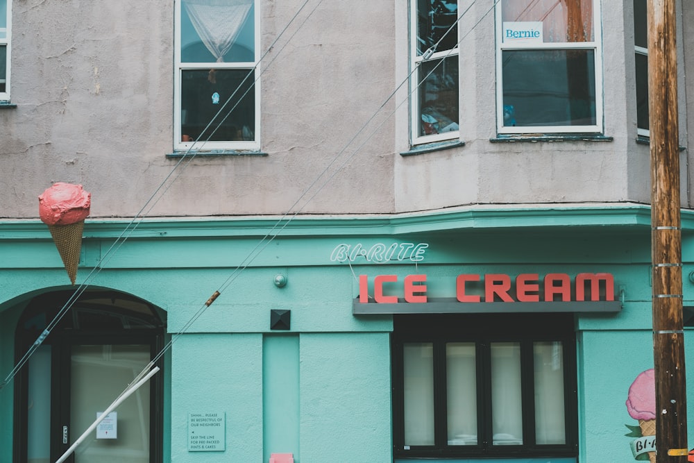 an ice cream shop on the corner of a city street